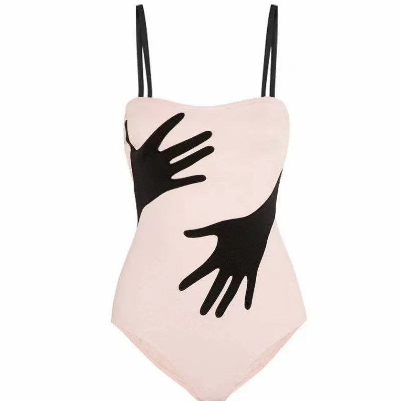 Women's one-piece bikini swimsuit with a gauze skirt, shown on a model.