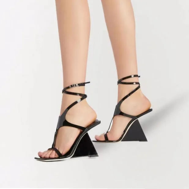 Women's black heel sandals with 9.5cm heel and button fastening, square toe design.