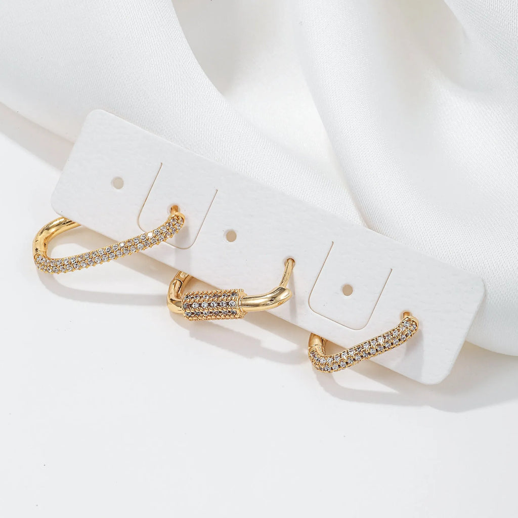 Geometric three-piece ear clip set with micro inlaid zircon detailing on copper in gold and white colour options