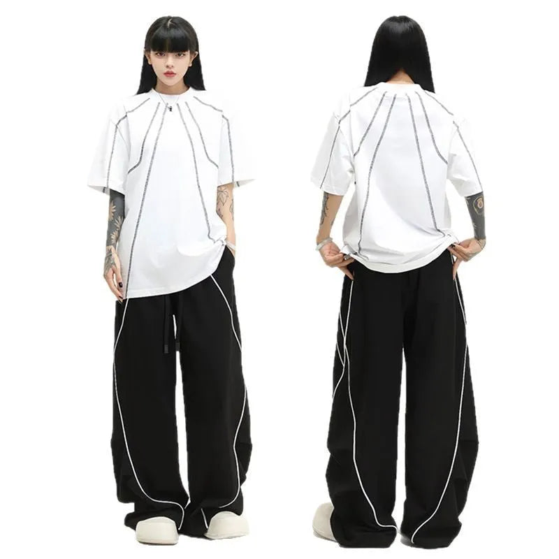 Black pleated wide-leg hip hop sports trousers with a striped pattern.