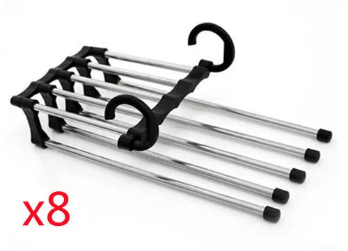 Black 5-in-1 stainless steel trouser hanger with five booms and dual hooks on a clothes rack