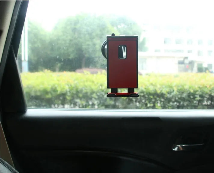 Black tablet PC universal stand car bracket mounted on dashboard centre console holding a tablet