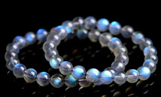 Natural cream body crystal blue moonlight bracelet showing polished finish on a simple band.