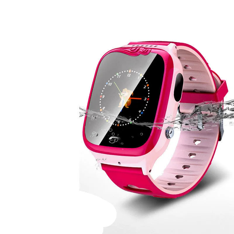 Children's phone watch with pink silicone strap showing HD touchscreen and camera