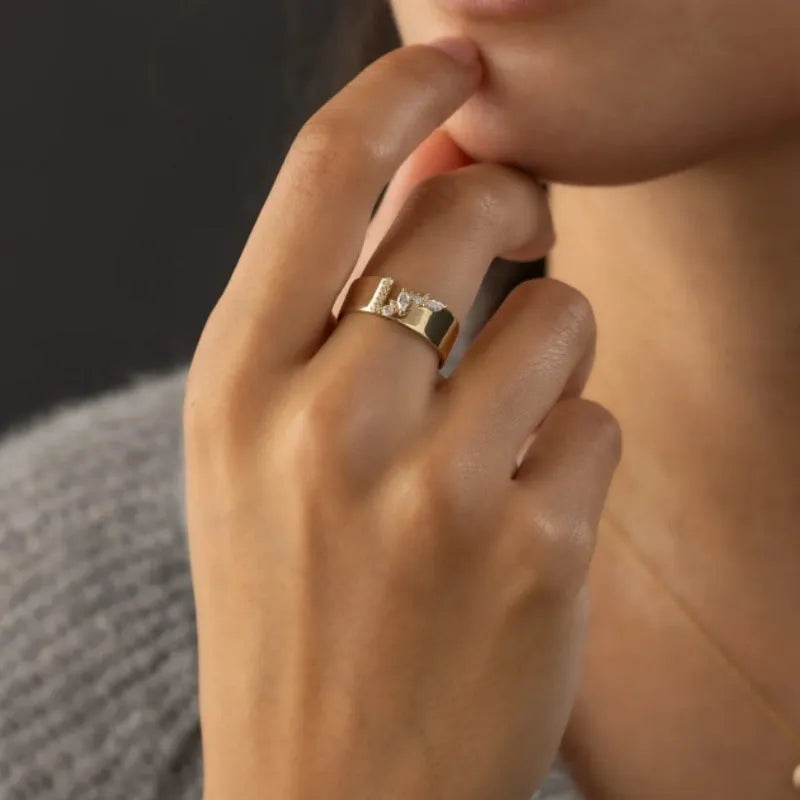 Gold-plated copper ring with shining zircon stones showing side and top views