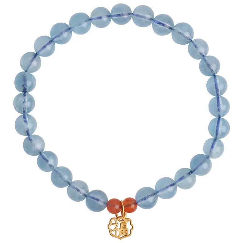 Natural ice translucent 8mm round crystal bead bracelet with sequin accents on display