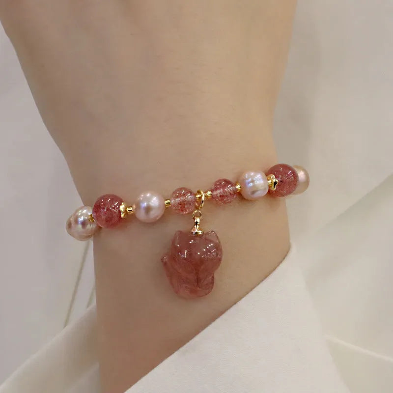 Women's natural freshwater pearl bracelet with light pink pearl, strawberry quartz, and fox charm on string