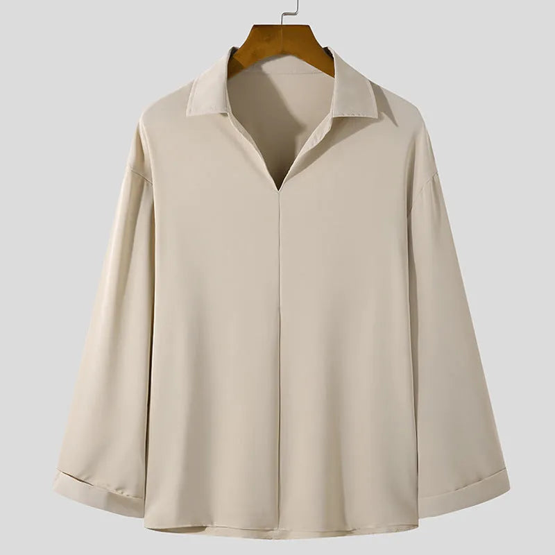 Men's loose fit long sleeve casual shirt in a solid colour, featuring a non-iron lightweight polyester blend fabric.