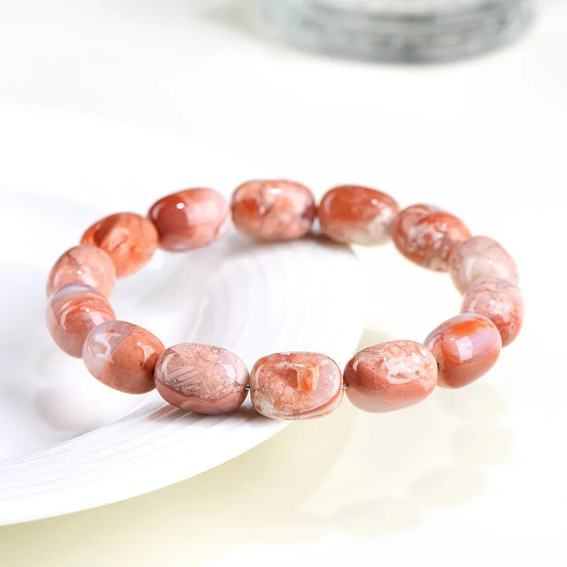 Natural cherry blossom agate bracelet with 10x14mm barrel beads and Ruyi geometric design elements