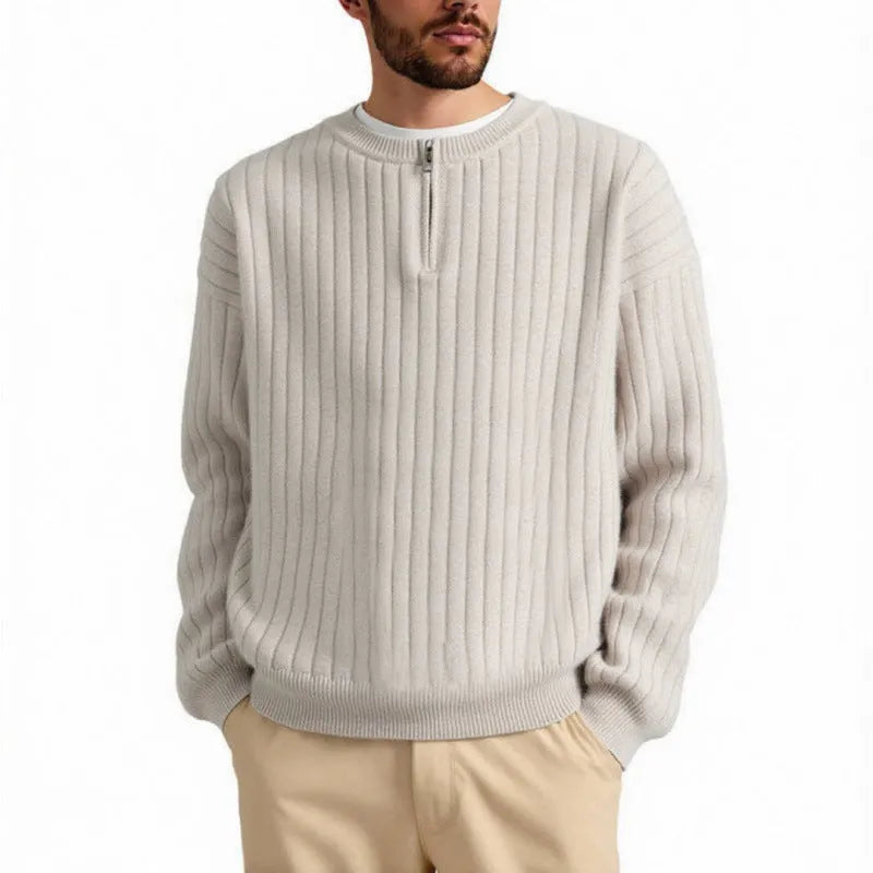 Men's loose grey half zip sweater with textured knit and long sleeves.