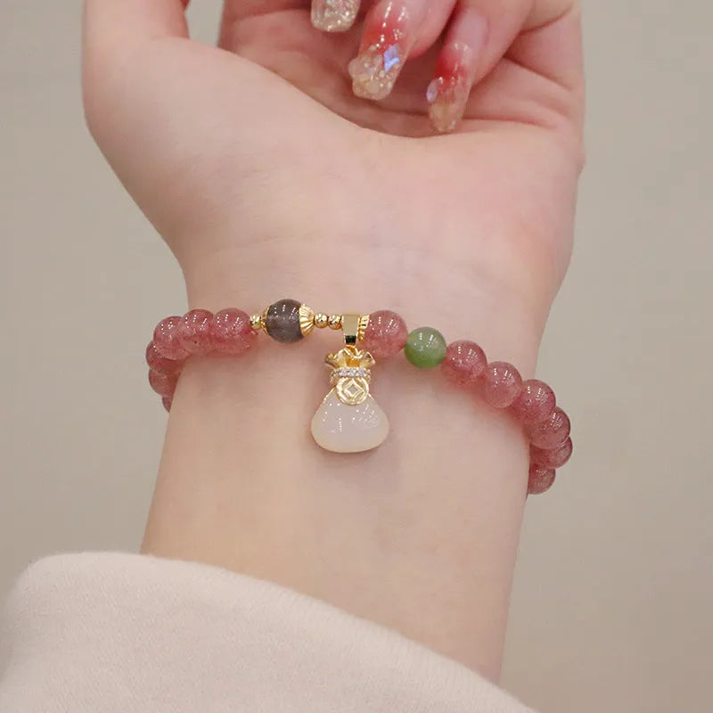 Geometric purse-style strawberry quartz bracelet for women with a peace buckle and safety clasp.