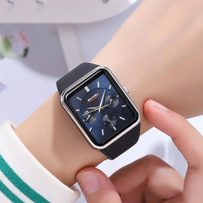 Multi functional square silicone waterproof watch for women, black gold colour, on wrist