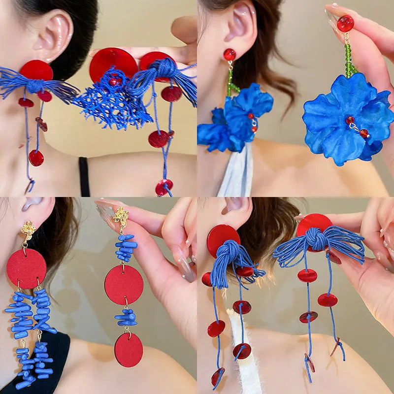 Women's geometric earrings with blue resin flowers on fabric in silver needle colour with circular design elements