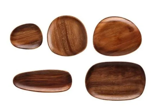 Acacia Japanese snack plate hand-polished natural wood with visible grain and mineral lines on a flat surface