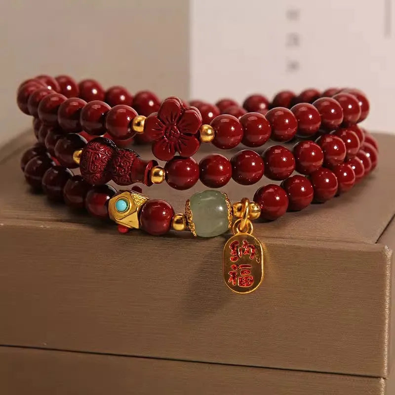 Multi-circle cinnabar bracelet with gourd and five petal flower motifs, polished finish, 6mm beads