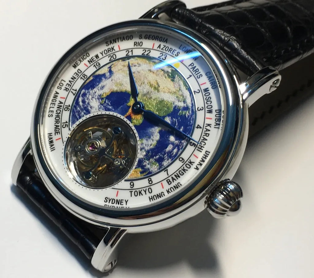 Silver 3D globe tourbillon mechanical watch with leather band and stainless steel case on white background