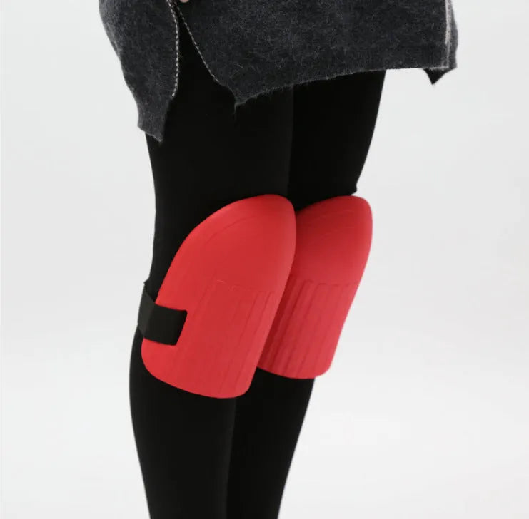 A pair of thick black EVA foam knee pads for gardening and DIY work.