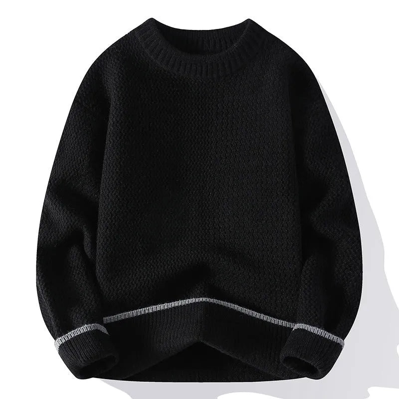 Man wearing a loose grey round neck pullover sweater, casual autumn outfit