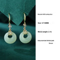 Hetian jade gourd bracelet set in 925 sterling silver with peace buckle and Fu character motifs on white background
