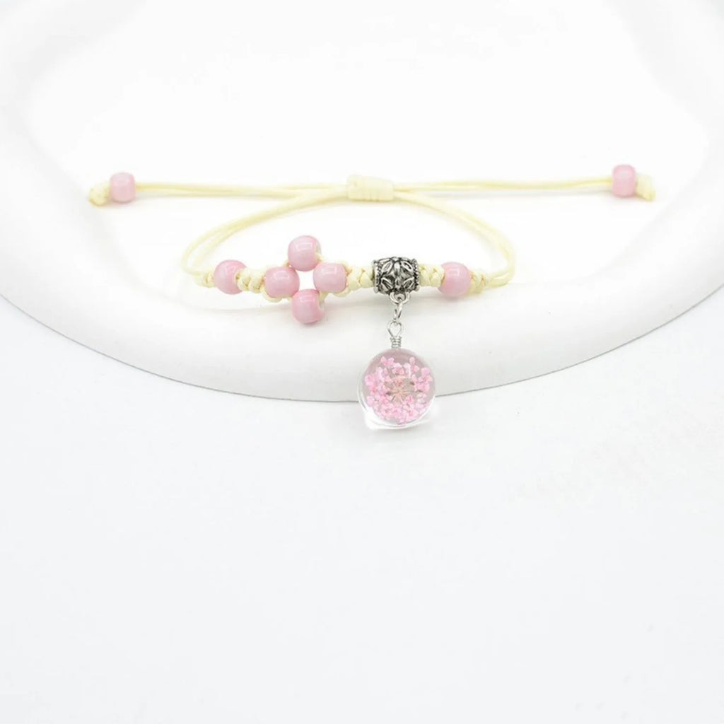 Glass dried flower bracelet with lace detailing and large 1.4cm beads in multiple colours.