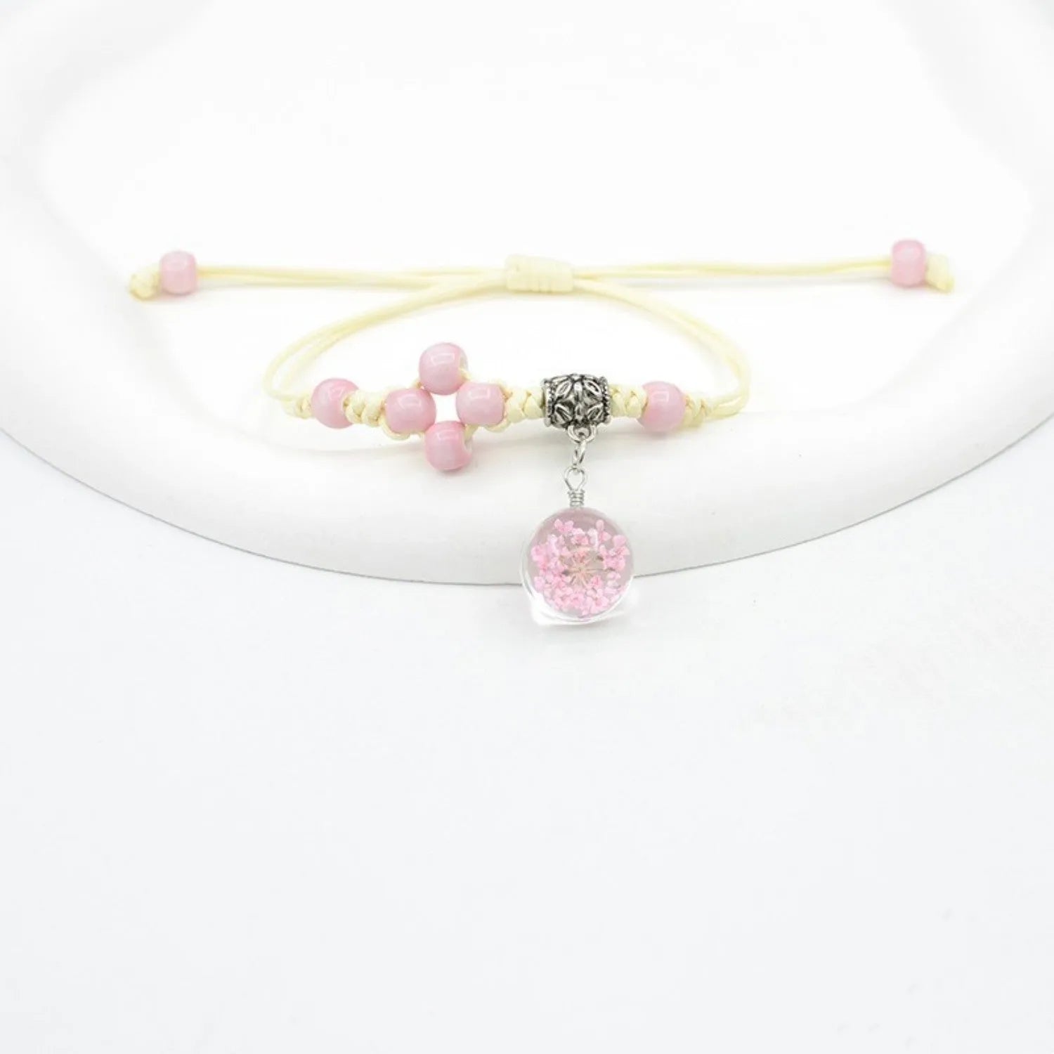 Glass dried flower bracelet with lace detailing and large 1.4cm beads in multiple colours.