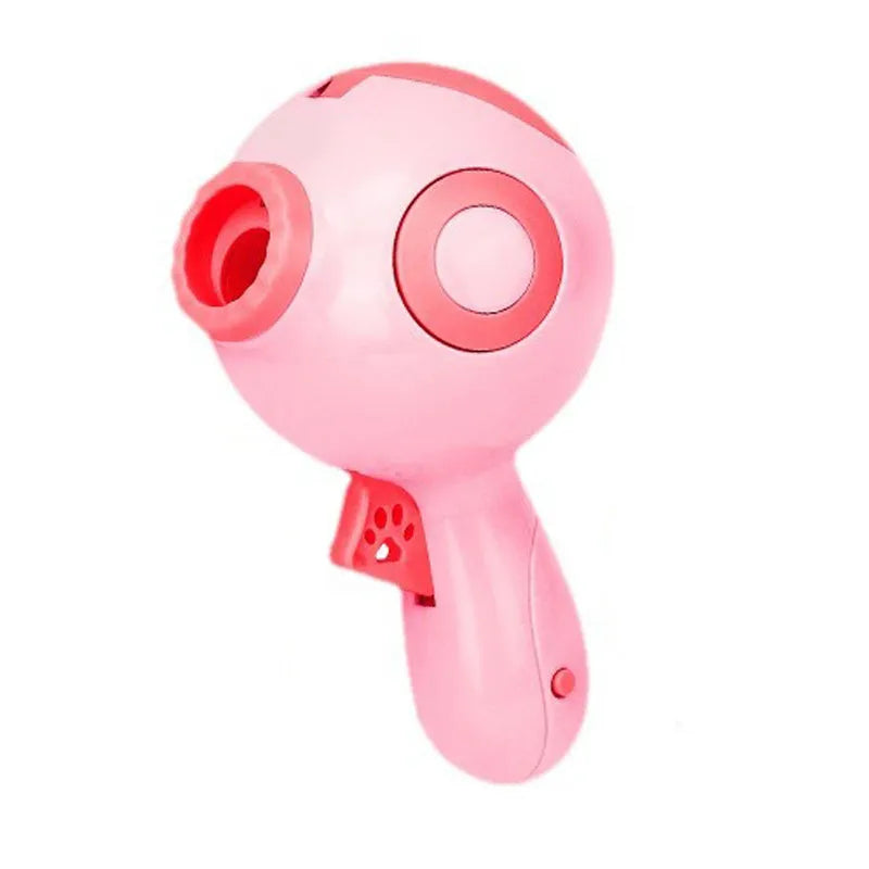 Green, orange, and pink plastic dog treat launcher toy for interactive feeding and training