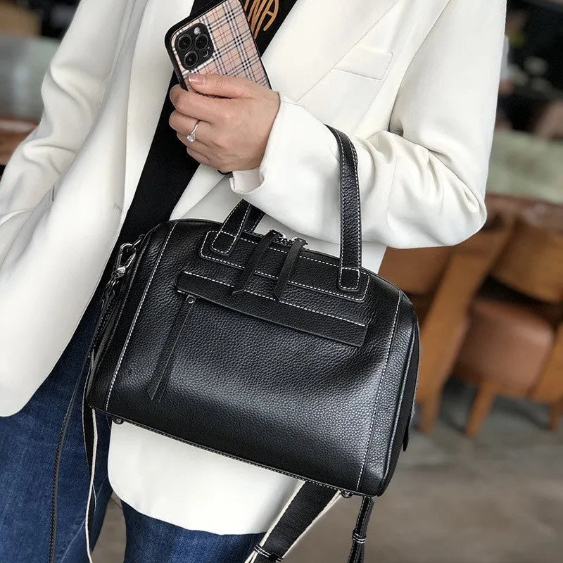 Genuine leather shoulder messenger bag with litchi pattern texture in a horizontal square shape.
