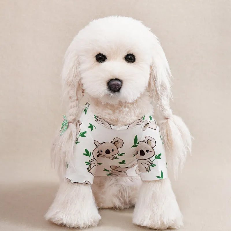 Colourful printed polyester T-shirt for a small dog, showing size chart for S, M, L, XL, and XXL.