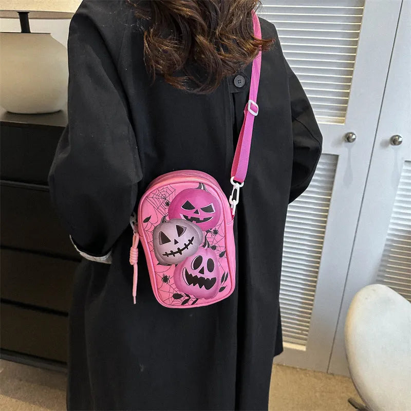 Halloween graffiti crossbody phone bag with pumpkin ghost bat prints in multiple colours