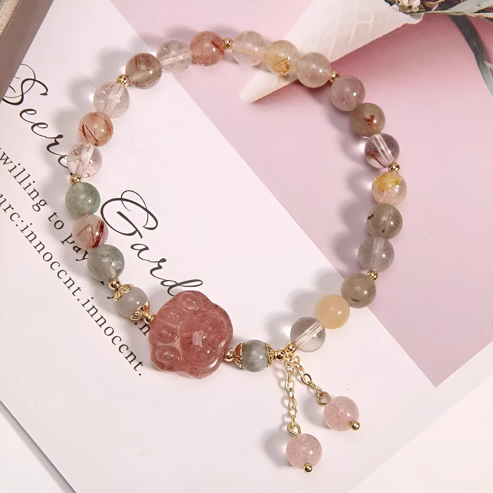 Single circle coloured hair crystal bracelet with zircon butterfly motif on light background