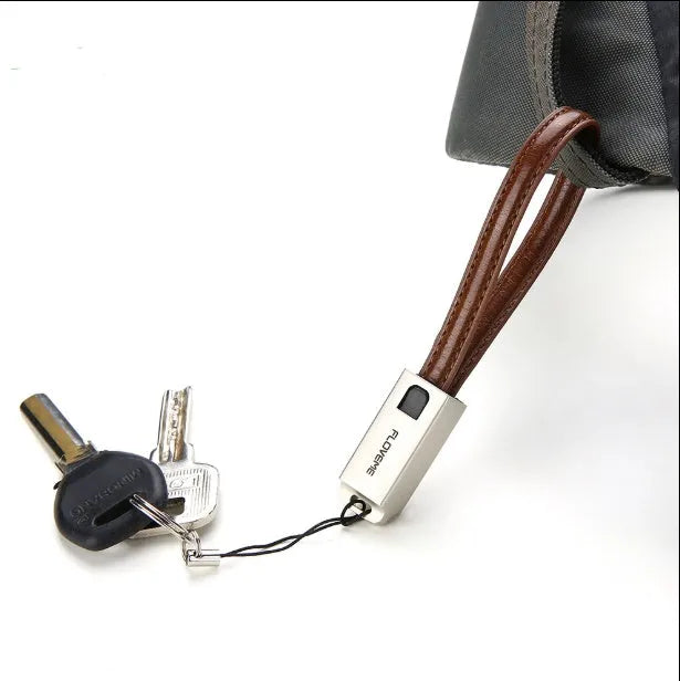 USB to Apple Lightning charging cable with leather braiding and zinc alloy connector in black, brown or red colours