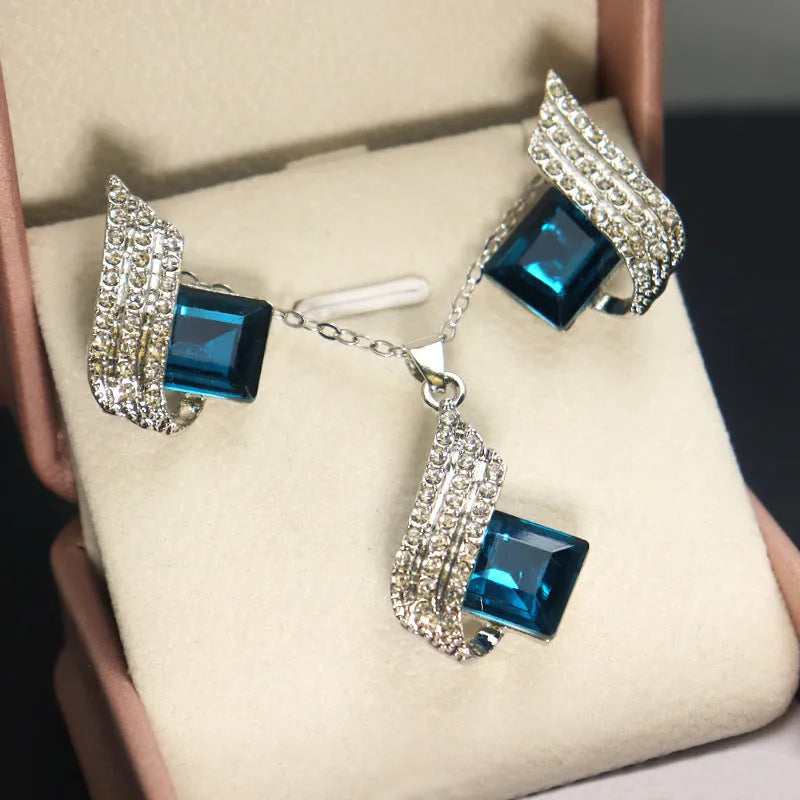 Women's electroplated alloy necklace and earrings set with glass detail and cross chain style