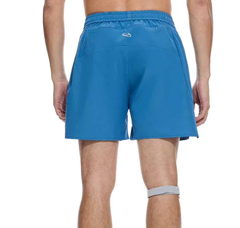 Black running shorts with laser stitching detail on a grey background.