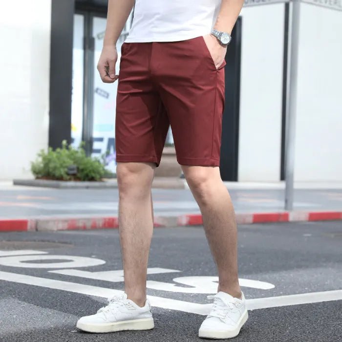 Men's loose elastic waist fifth pants in solid colour polyester, available in multiple colours including khaki and grey.