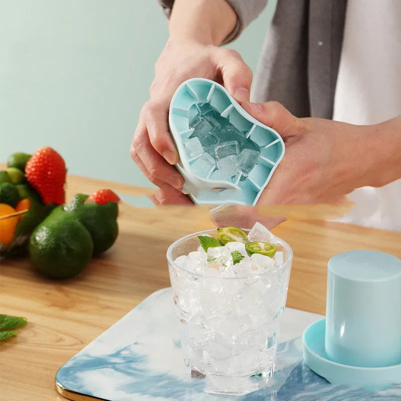 Portable 2-in-1 ice bucket mold with lid made of food-grade silicone in blue-green colour
