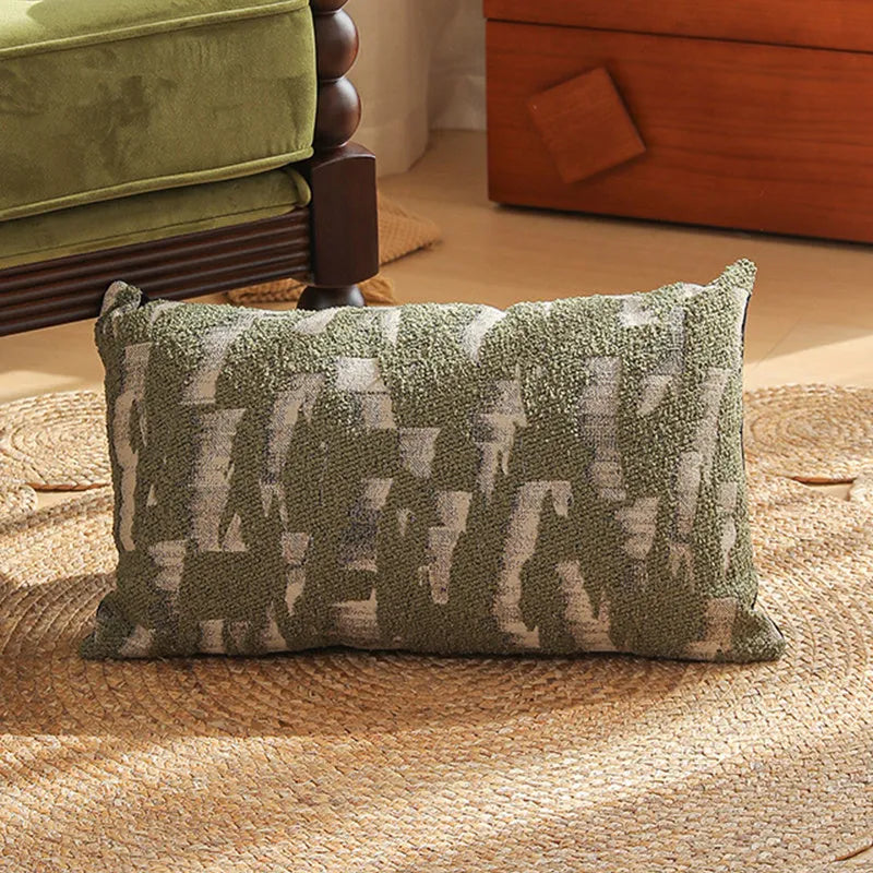 Close-up of a square jacquard pillow cover with a woven retro floral pattern in various colours, sized 45 by 45 cm.