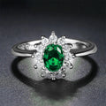 Blue moissanite flower-shaped copper ring for women on a ring size chart showing sizes 6 to 10.