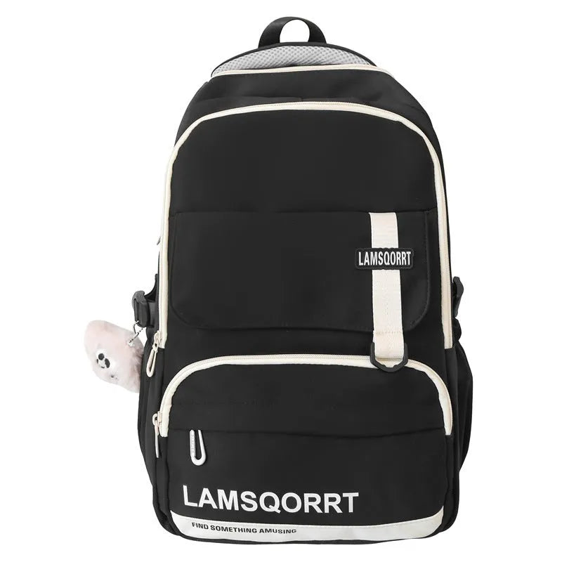 Nylon waterproof school backpack in black with curved shoulder strap and sewing line detail
