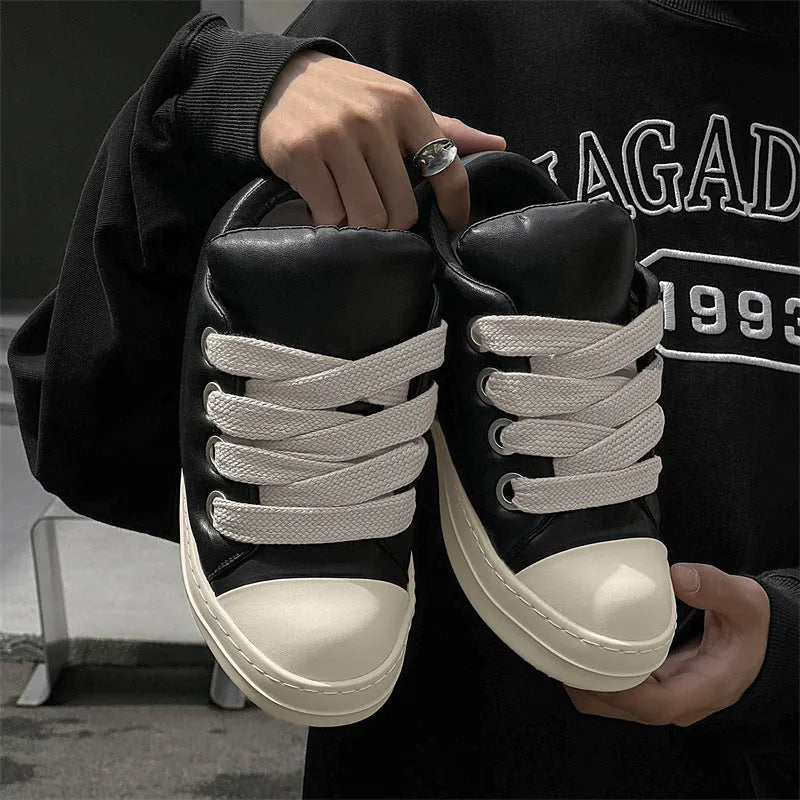 Men's black leather low-top slip-on casual shoes with raised bottom board, round toe, and front lace-up