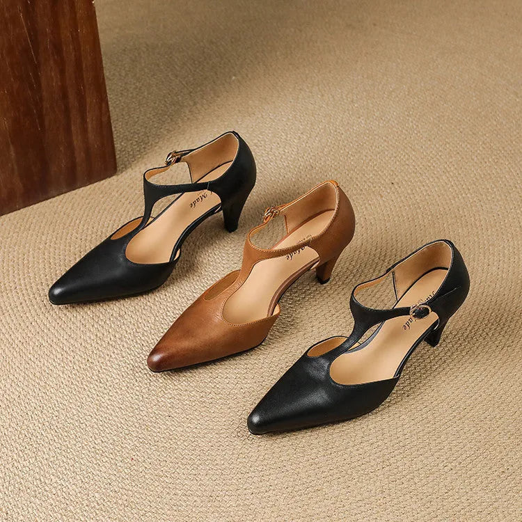 Brown retro women's T-strap sandals with a buckle, closed toe, and a short stout heel.