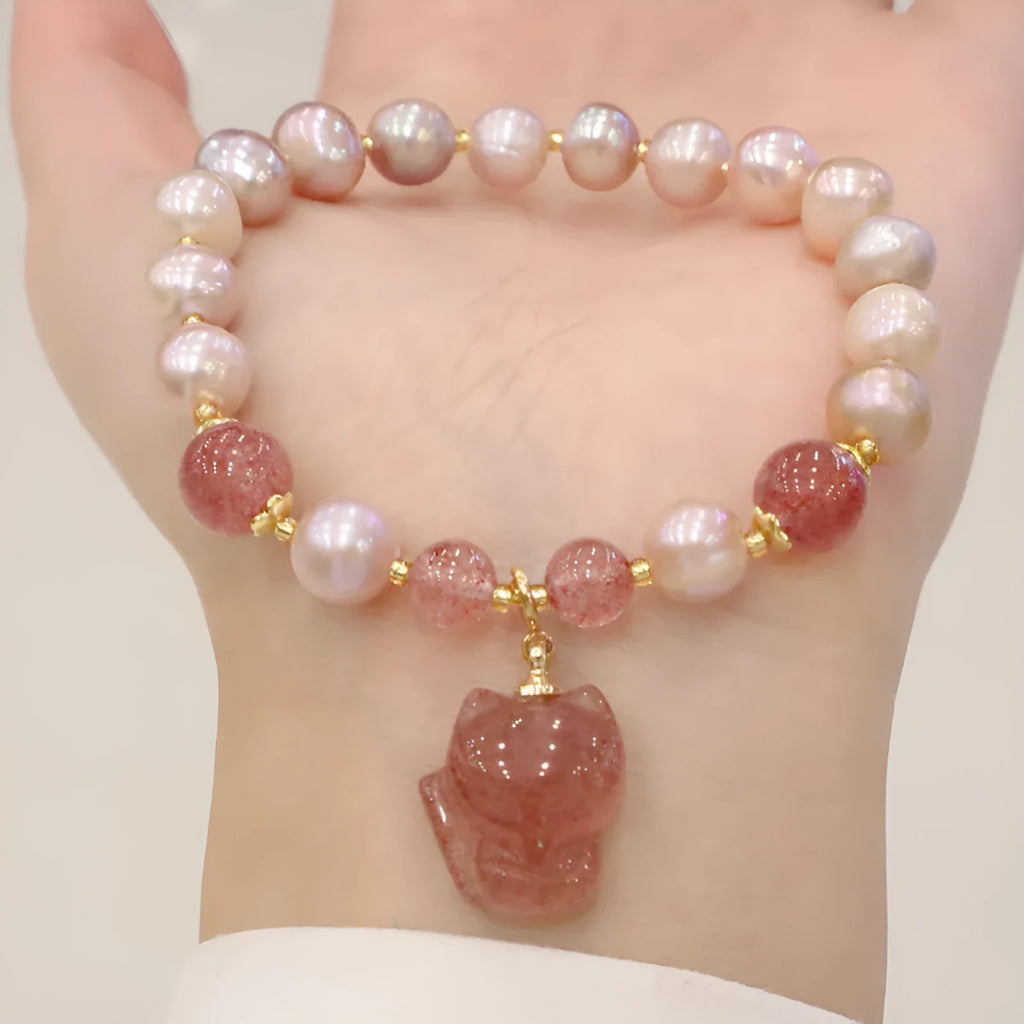 Women's natural freshwater pearl bracelet with light pink pearl, strawberry quartz, and fox charm on string