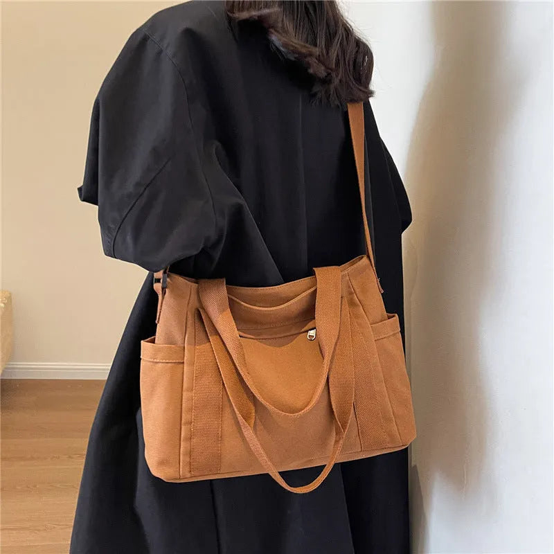 Large capacity shoulder canvas tote bag in solid colour with external sandwich pocket