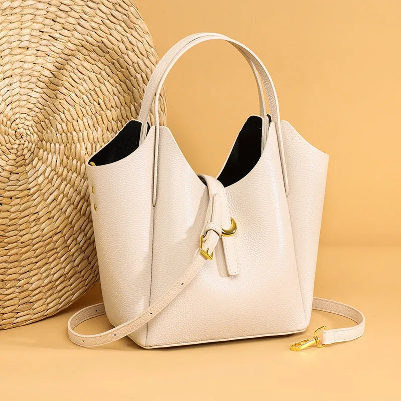 Genuine leather women's bucket handbag in European American retro style with hand holding design
