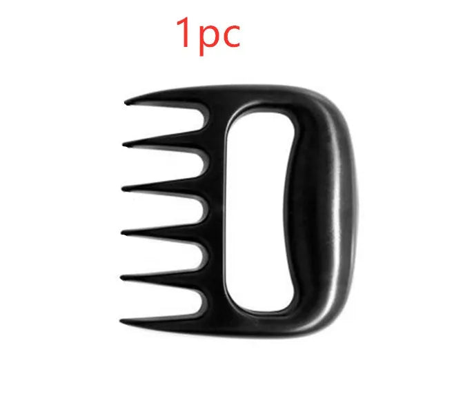 Two black PC plastic bear claw shredders for meat lying side by side on a cutting board