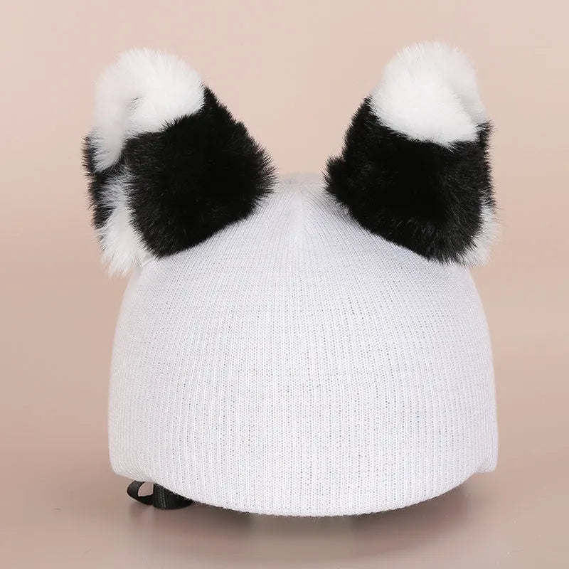 Plush cartoon hat decoration designed to attach to a ski helmet for personalisation