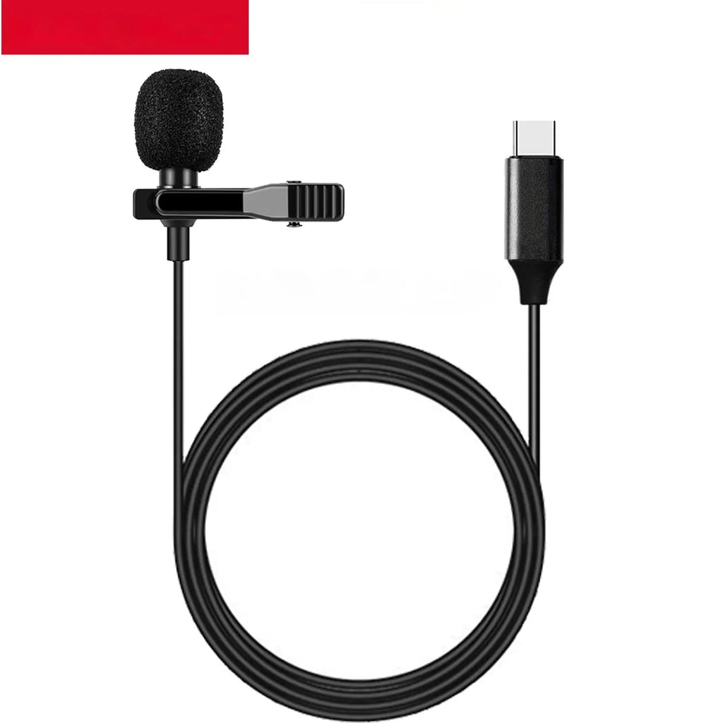 Black USB-C lavalier microphone with metal clip and sponge cover on a table