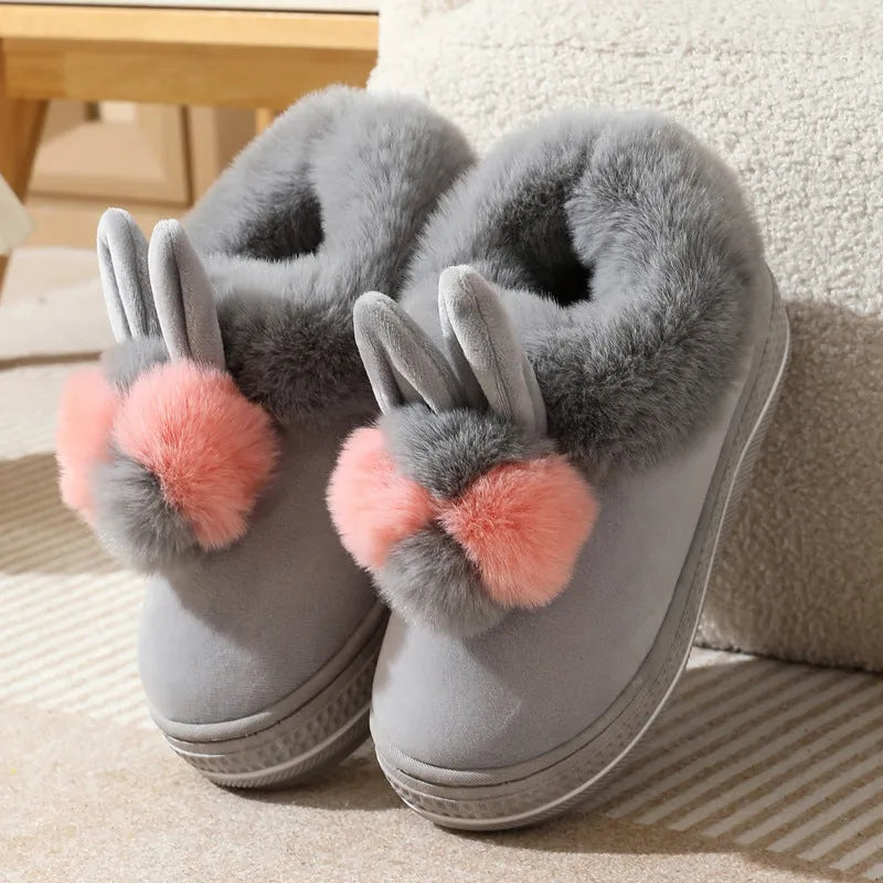 Winter high heel slippers with plush upper and thick TPR sole in gray colour on a floor