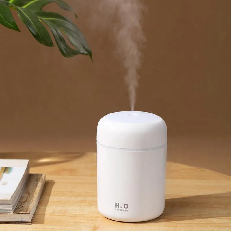Mini USB desktop humidifier in pink with 300ml tank, low noise, and colourful atmosphere lights