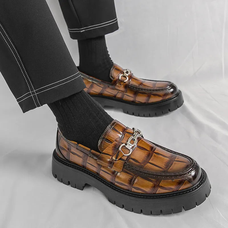 Pair of autumn men's crocodile pattern leather loafers in brown with flat heel platform sole
