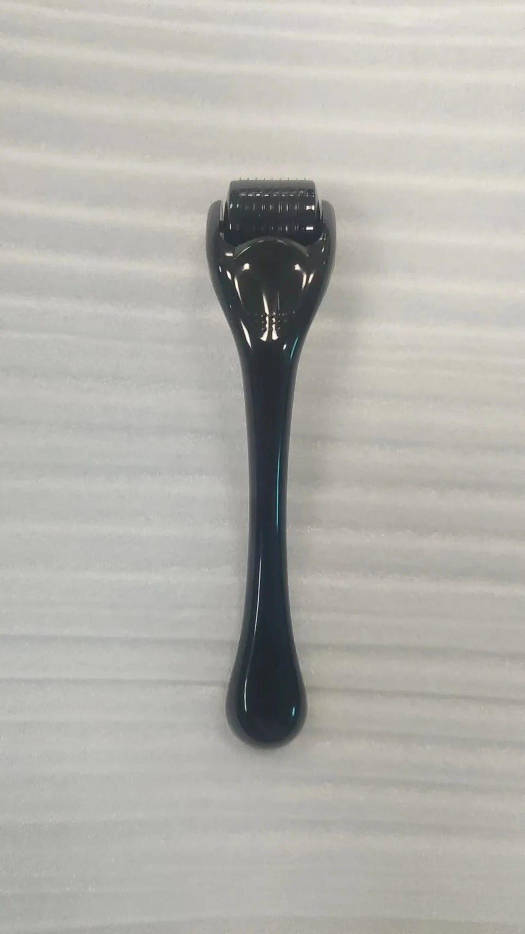 540 needle derma roller with black handle and coloured wheel, showing 0.25mm 0.3mm size options for micro-needling.